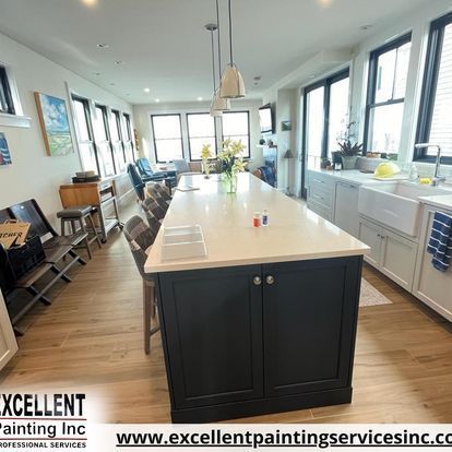 A kitchen with a large island and a sink.