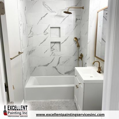 A bathroom with a tub, sink, mirror and shower.