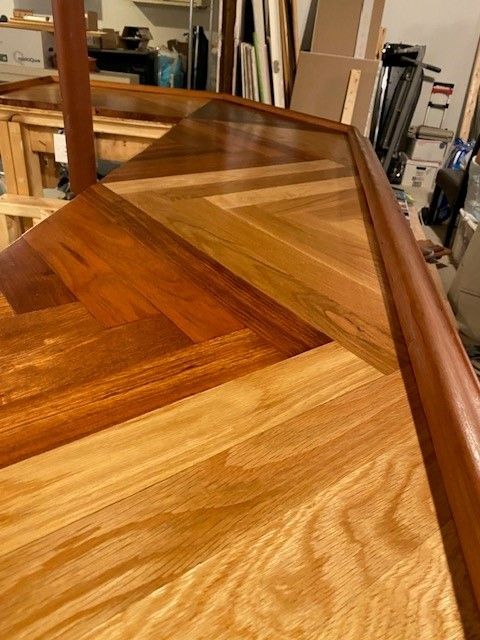 a close up of a wooden table with a wooden frame 