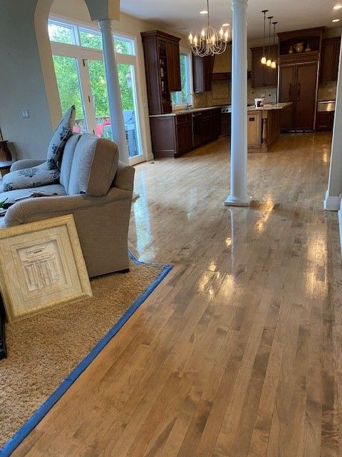 a living room with hardwood floors and a couch