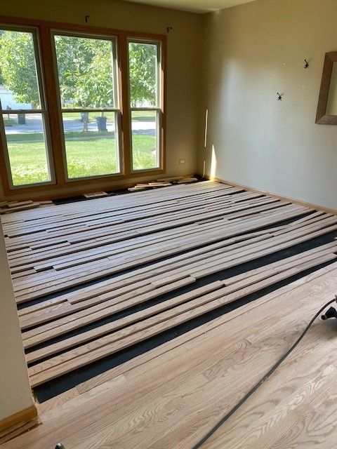 a room with a lot of wooden boards on the floor