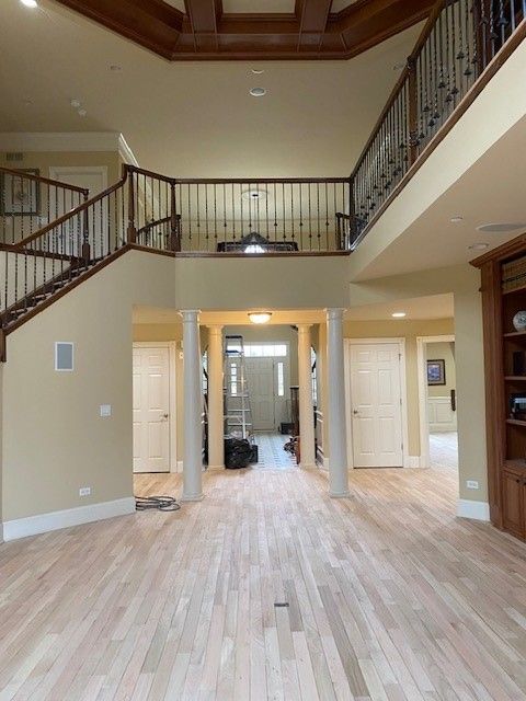 a large room with stairs leading up to the second floor