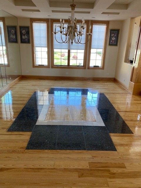 there is a chandelier in the middle of the room.