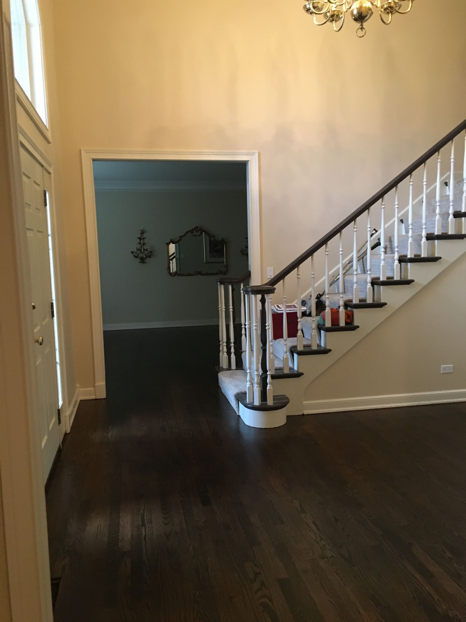 an empty hallway with stairs leading up to the second floor