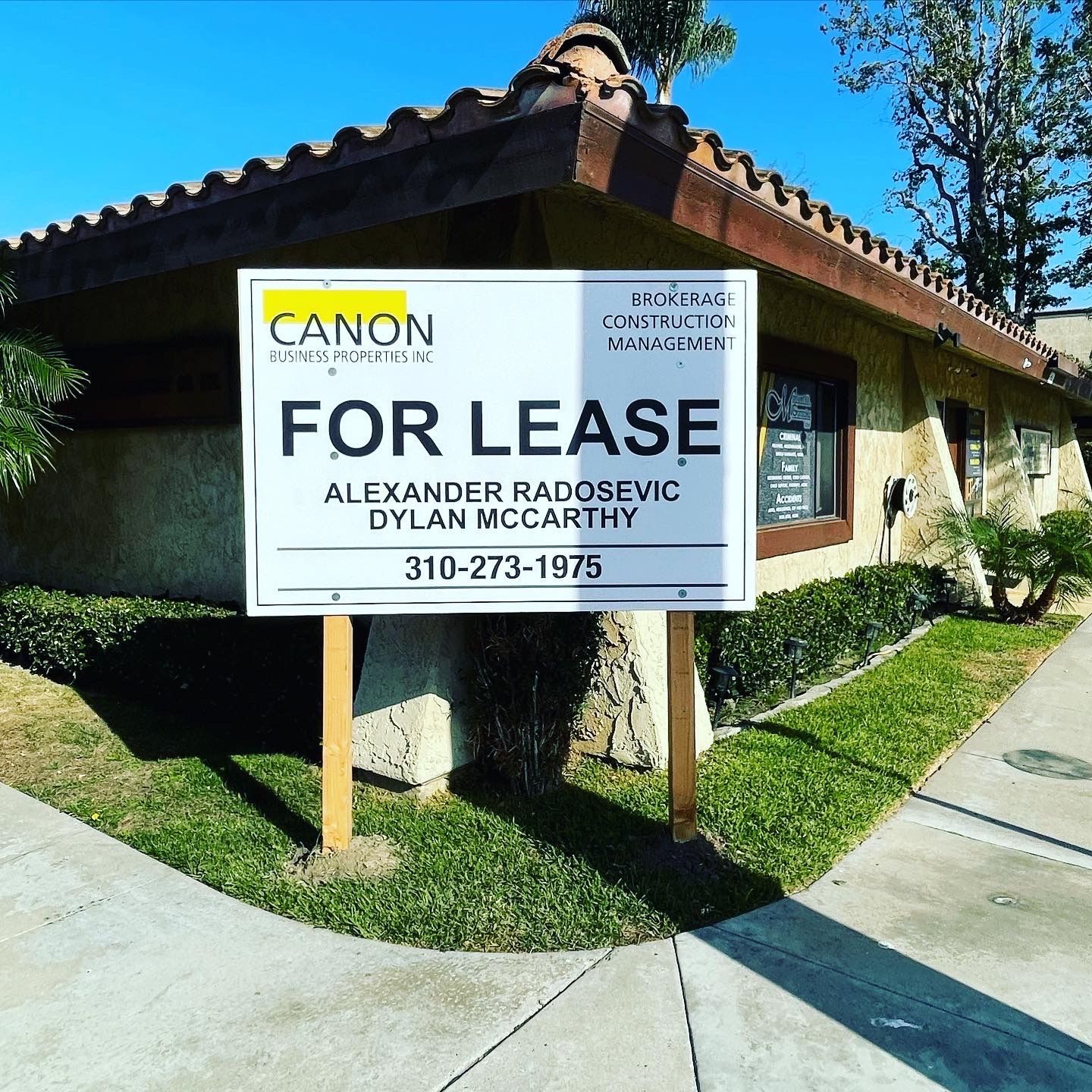 A for lease sign in front of a building
