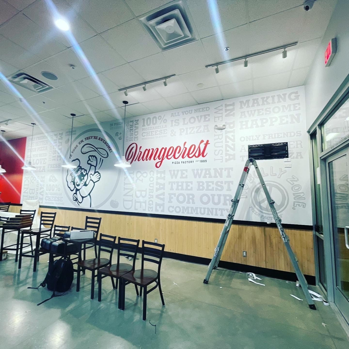 A restaurant with a sign that says orangecrest on it