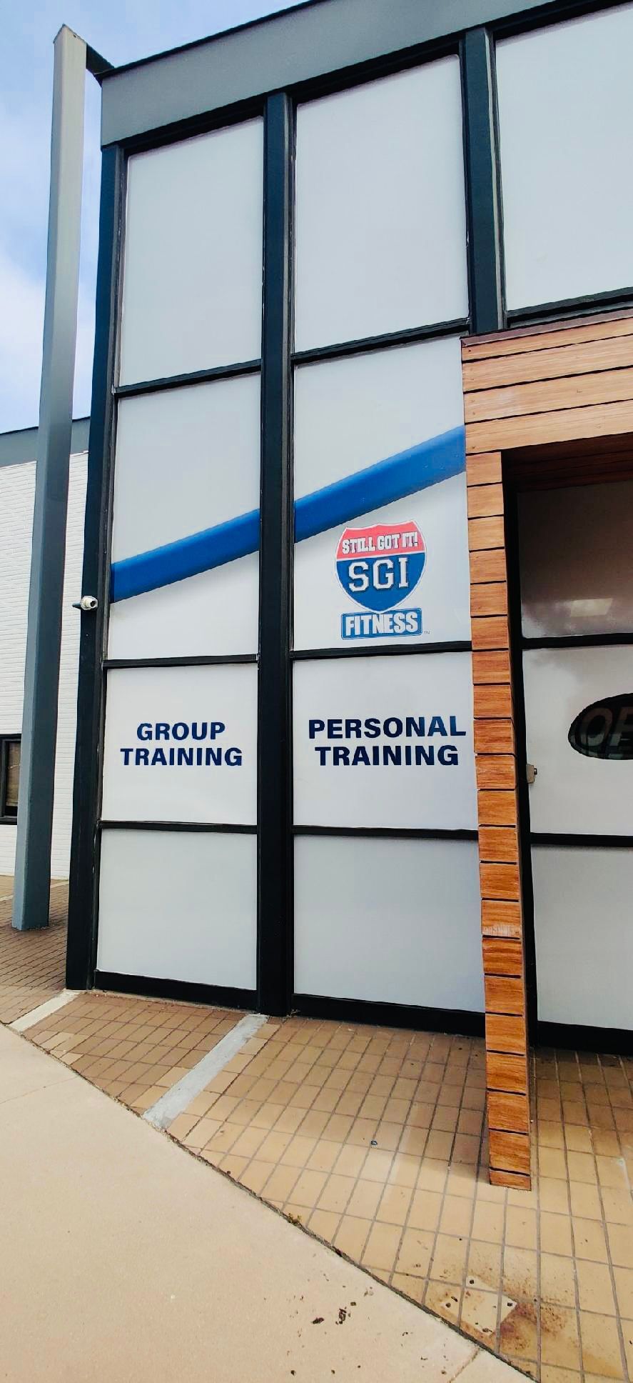 A building with a sign that says personal training on it