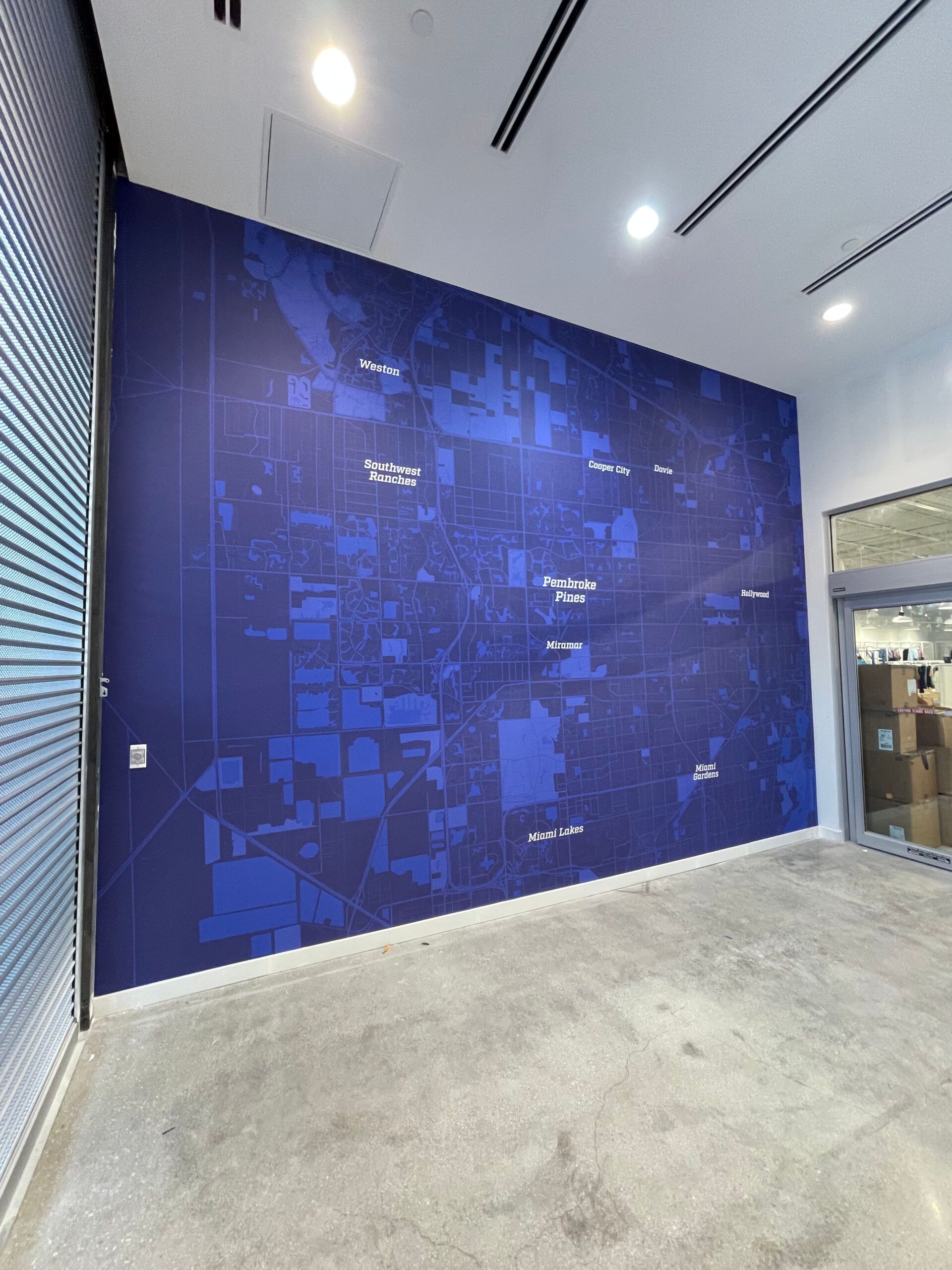A large blue wall with a map on it