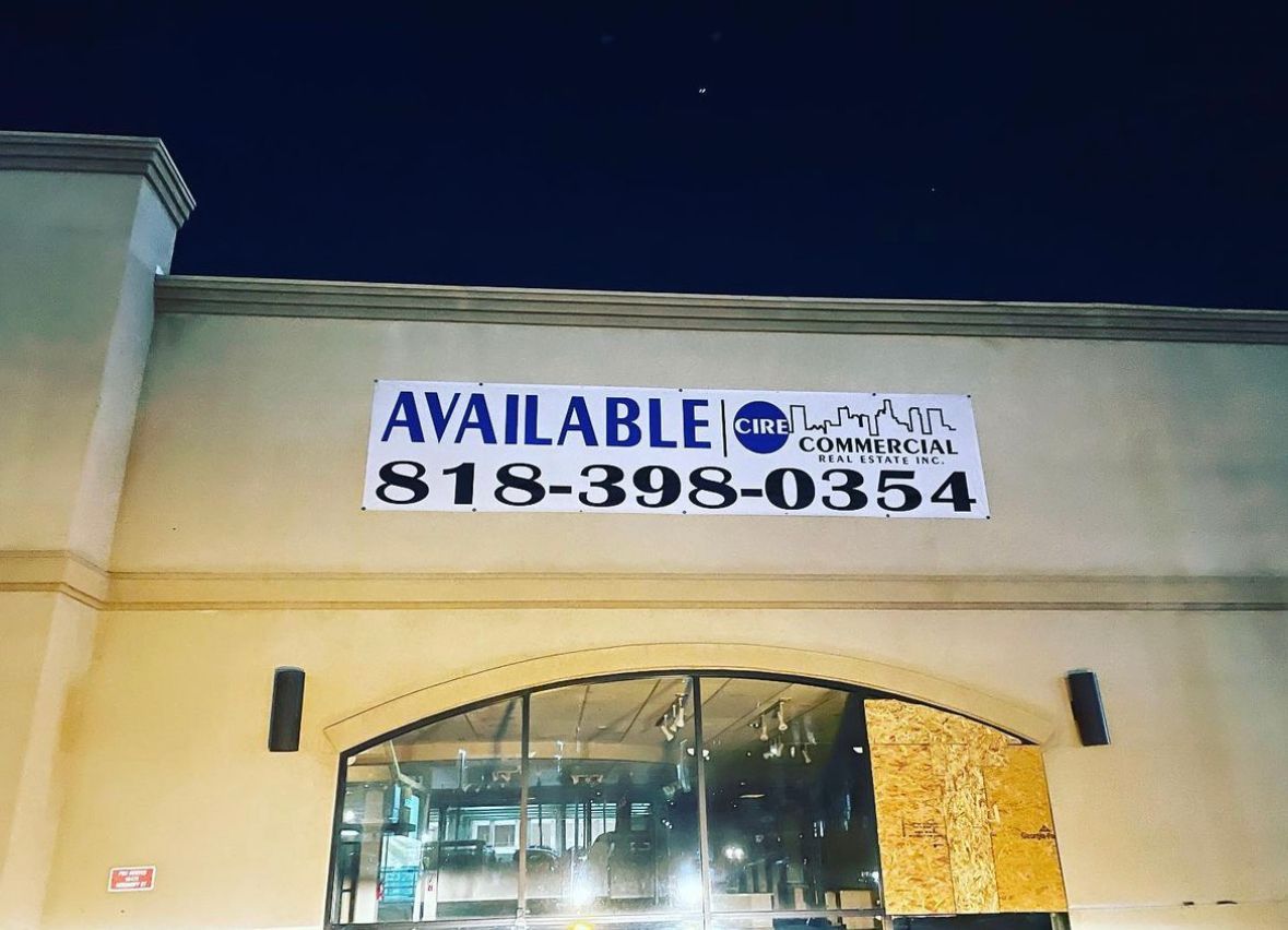 A building with a sign that says available on it