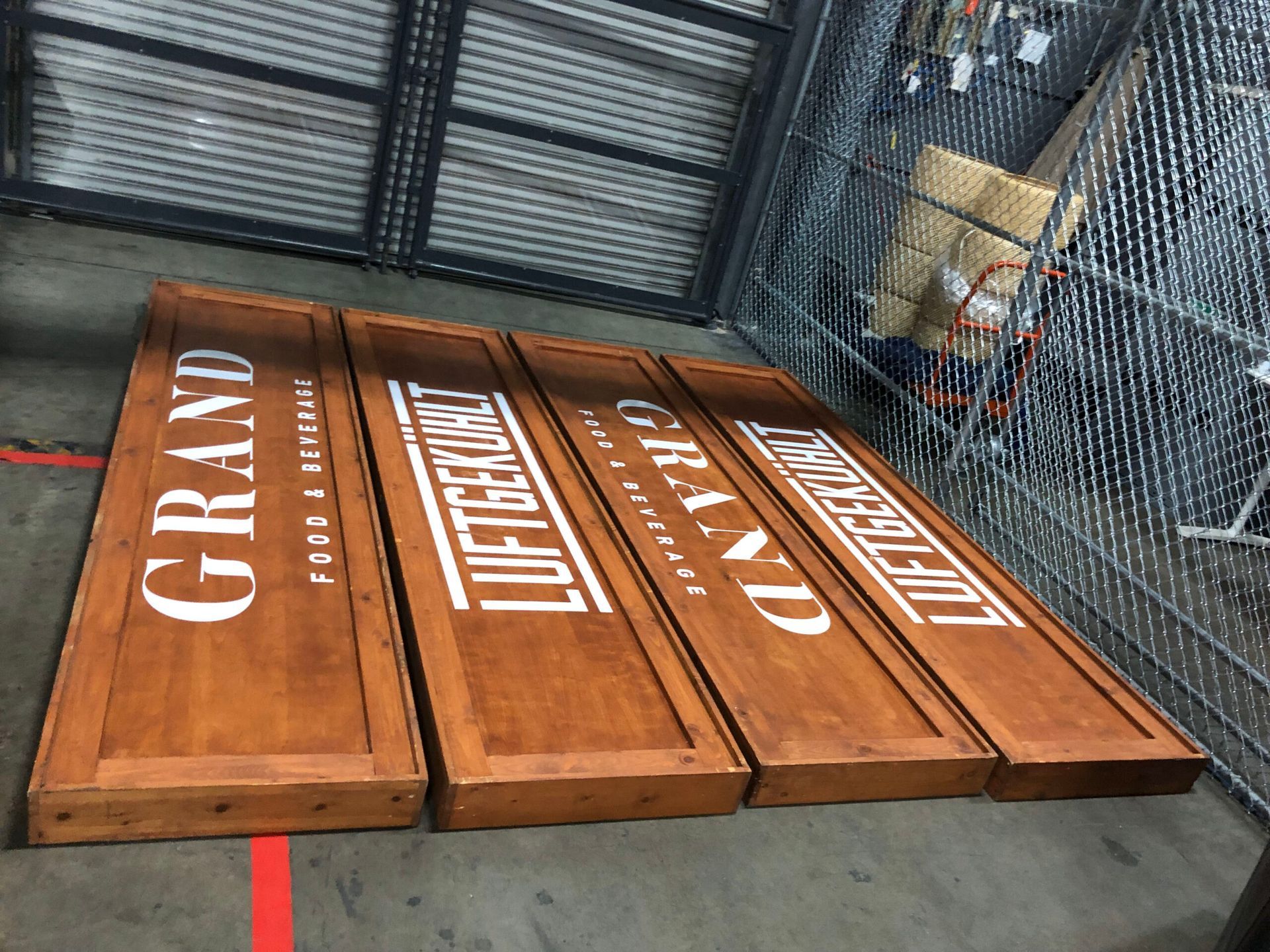 Three wooden signs with the word grand on them