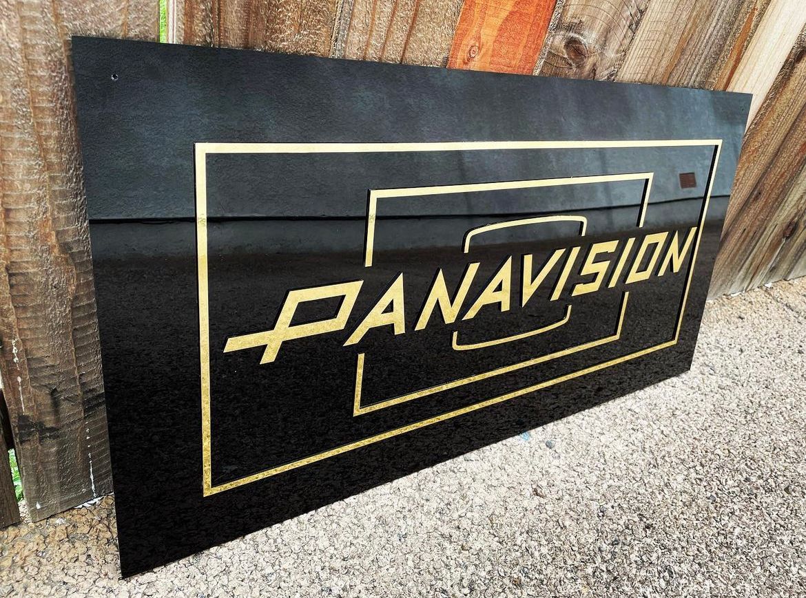 A black sign that says panavision on it
