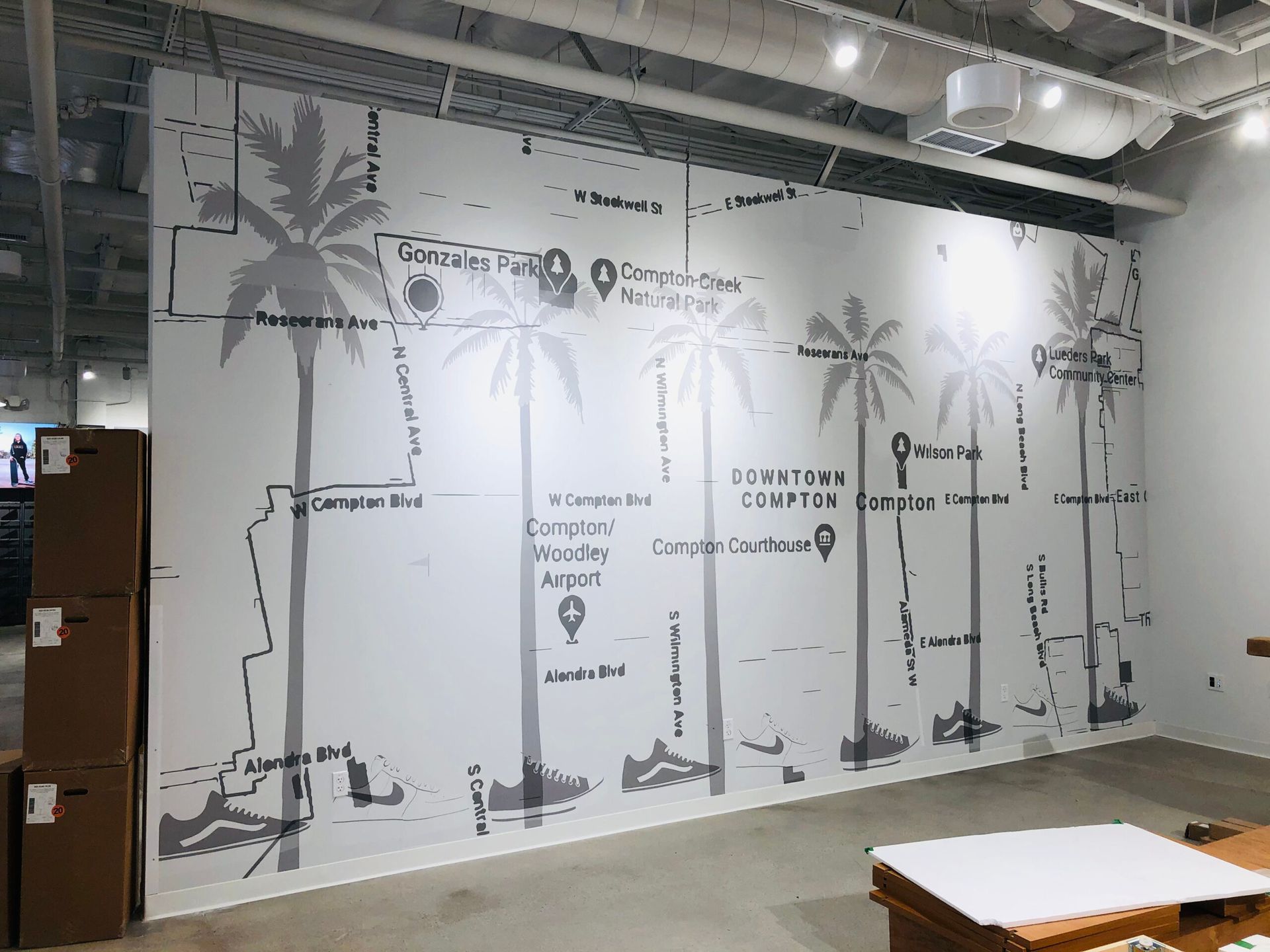 A wall with a map of palm trees on it.