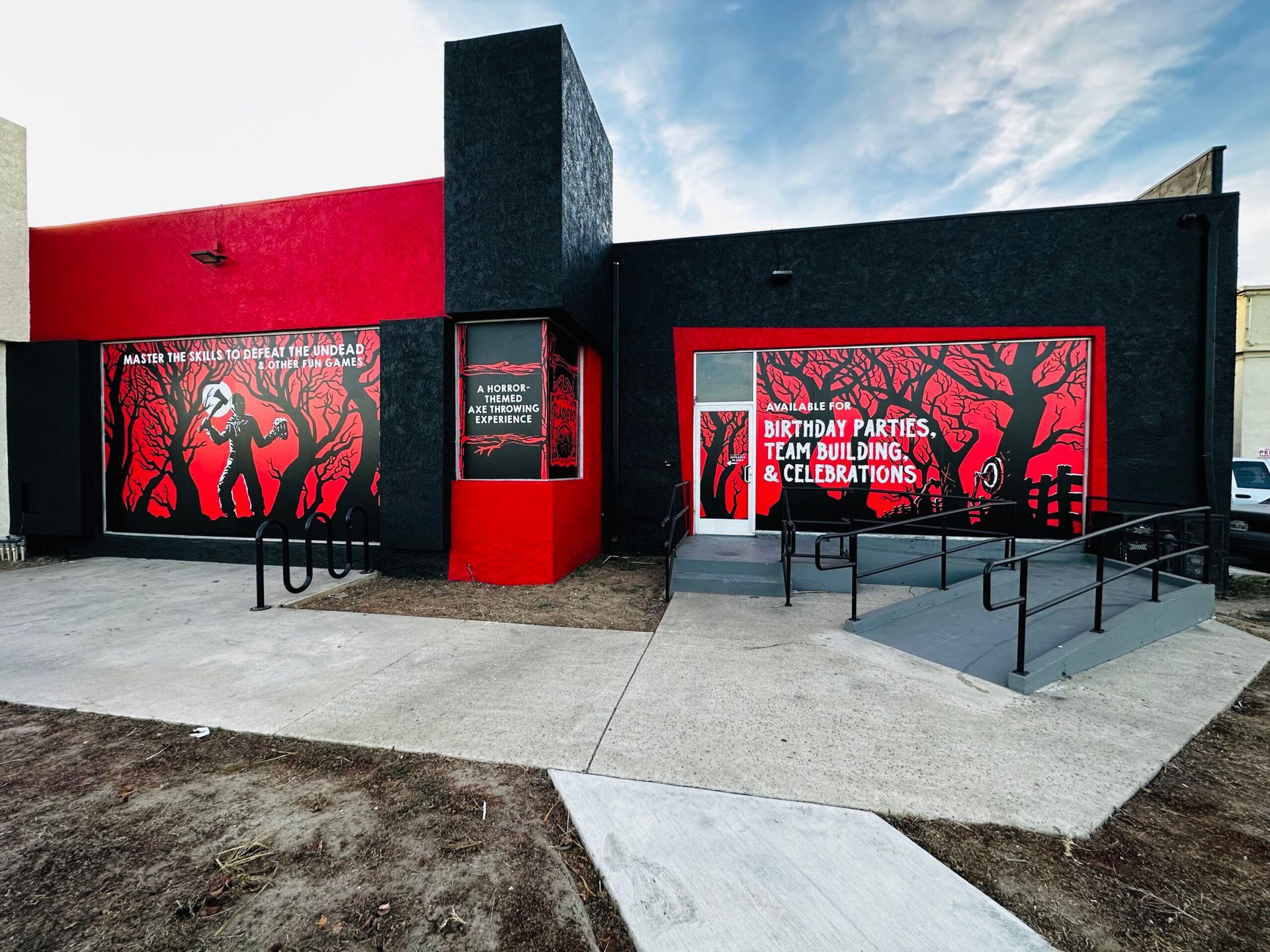 A black and red building with a sign that says retreat parties