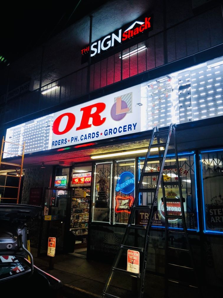 A store front with a sign that says grocery on it