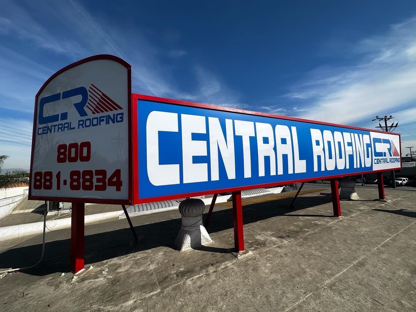 A billboard for central roofing says 800 881-8834