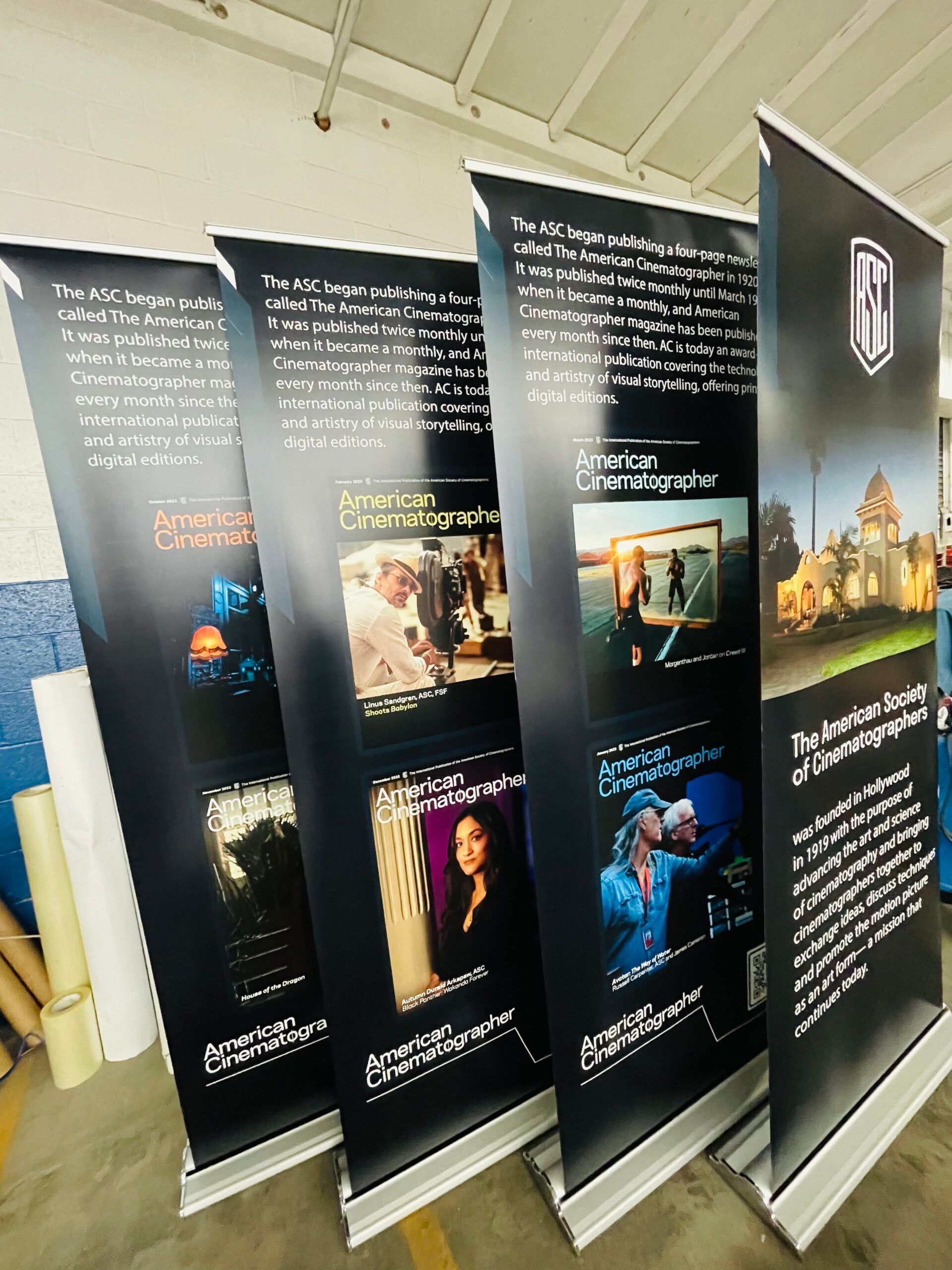 A bunch of banners are lined up in a row