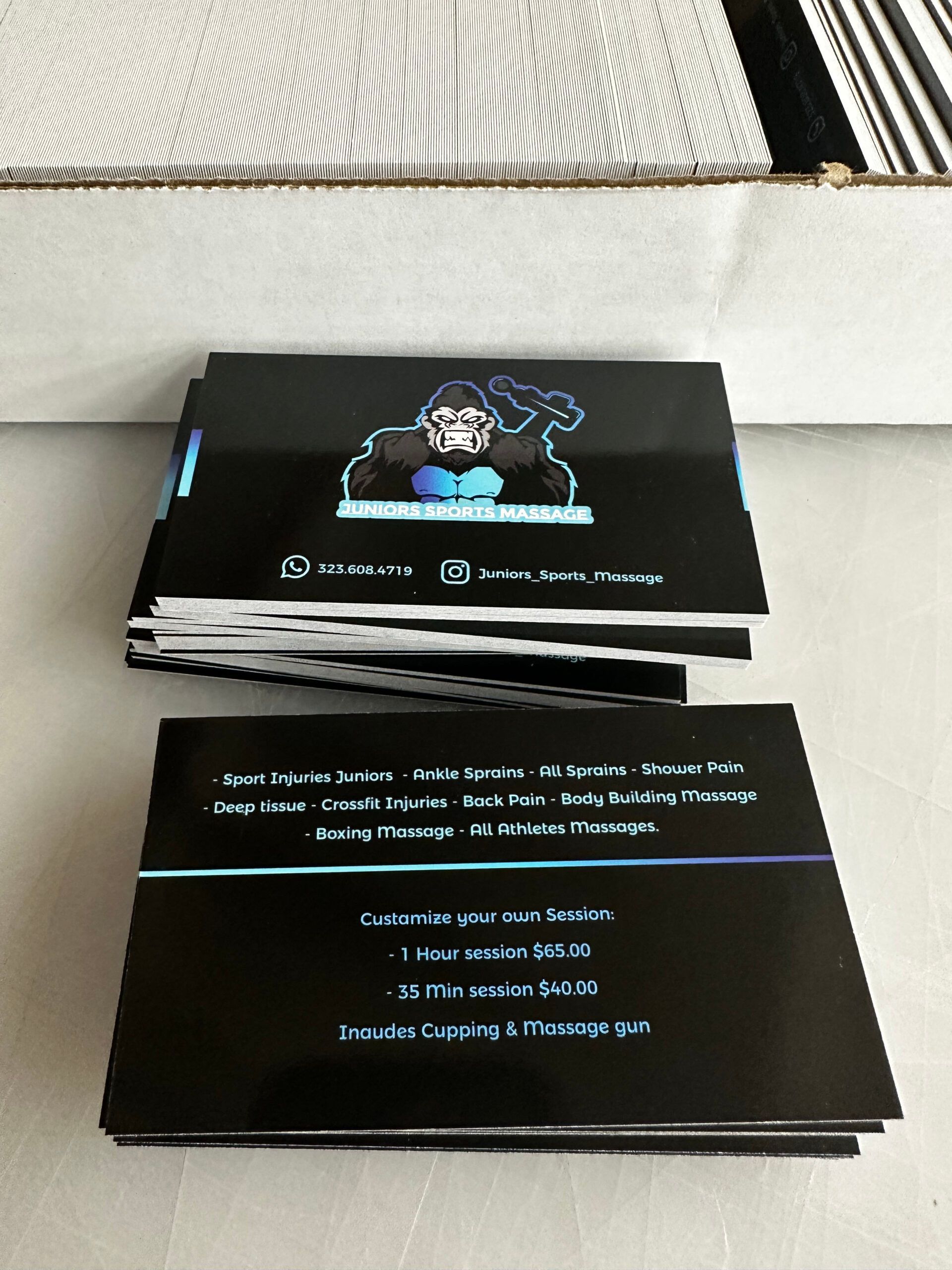 A bunch of business cards are stacked on top of each other