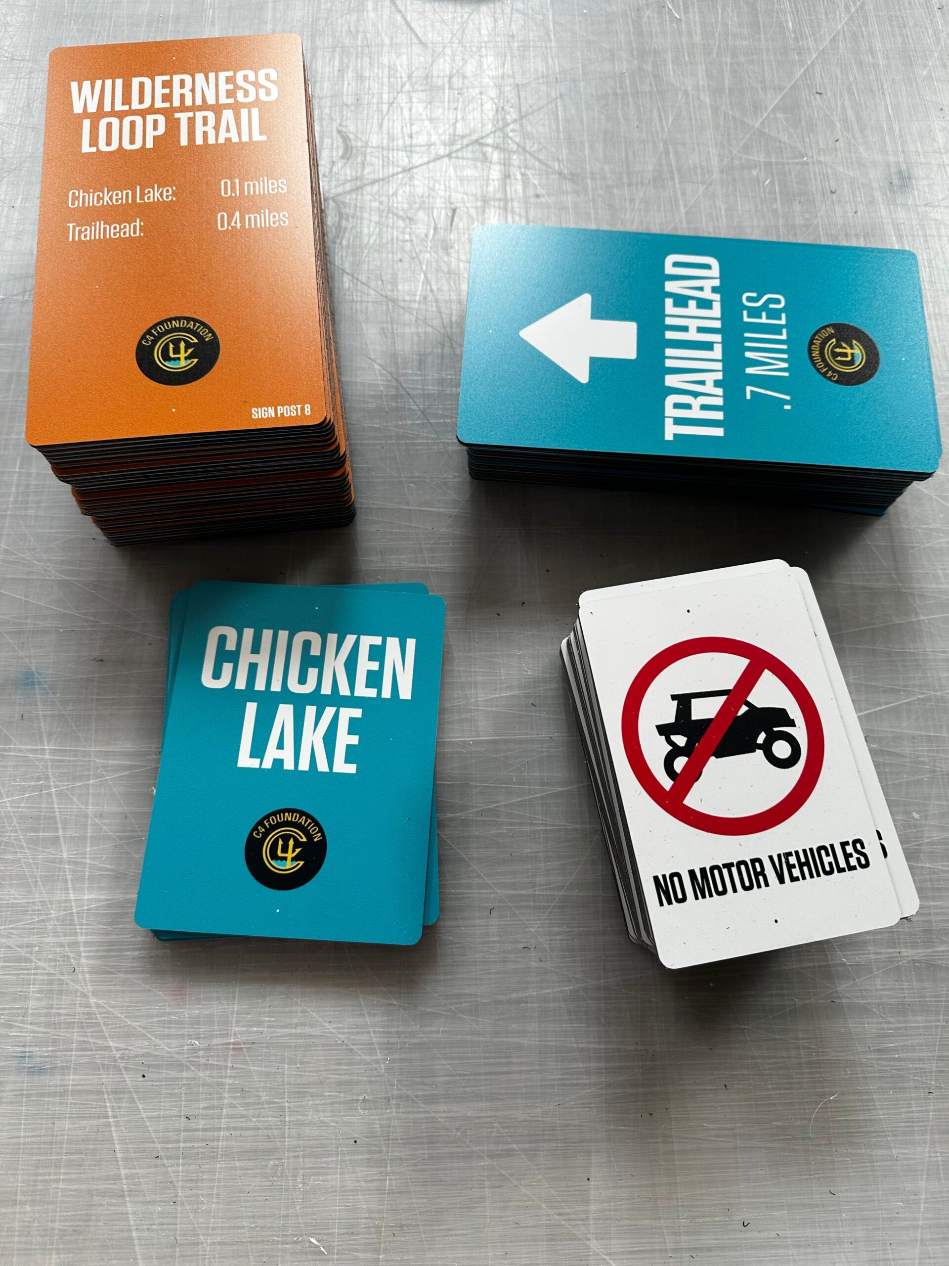 A stack of cards with one that says chicken lake