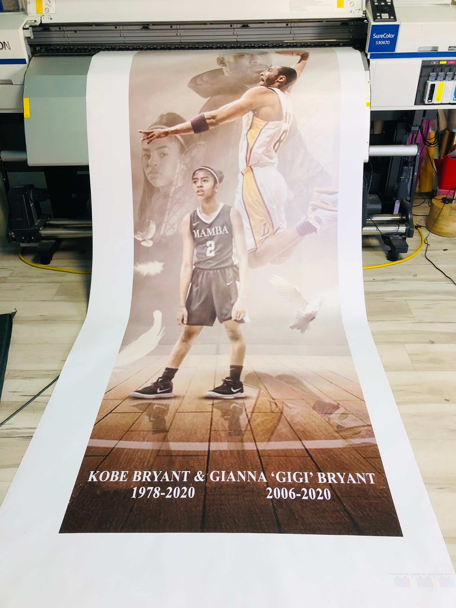 A poster of kobe bryant and gianna gigi bryant