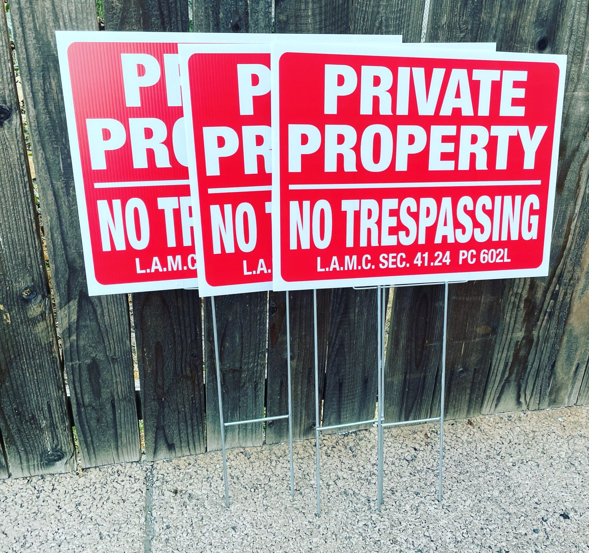 A couple of signs that say private property no trespassing