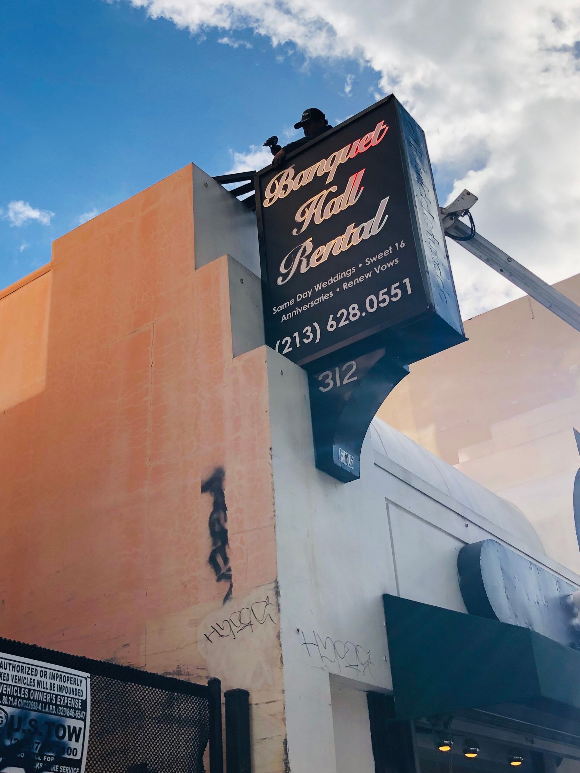 A sign on the side of a building that says banquet hall rental