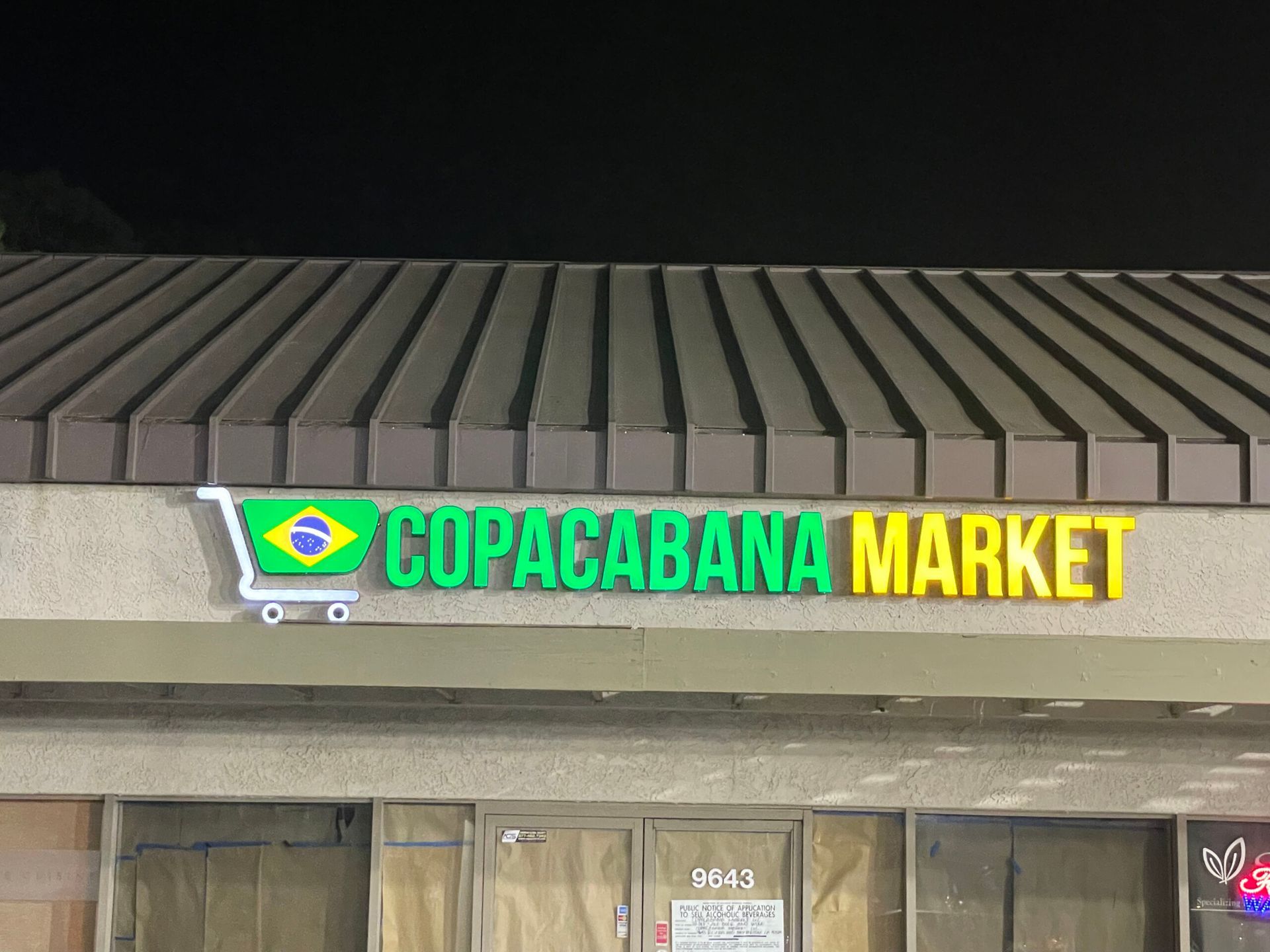 A store front with a sign that says copacabana market.