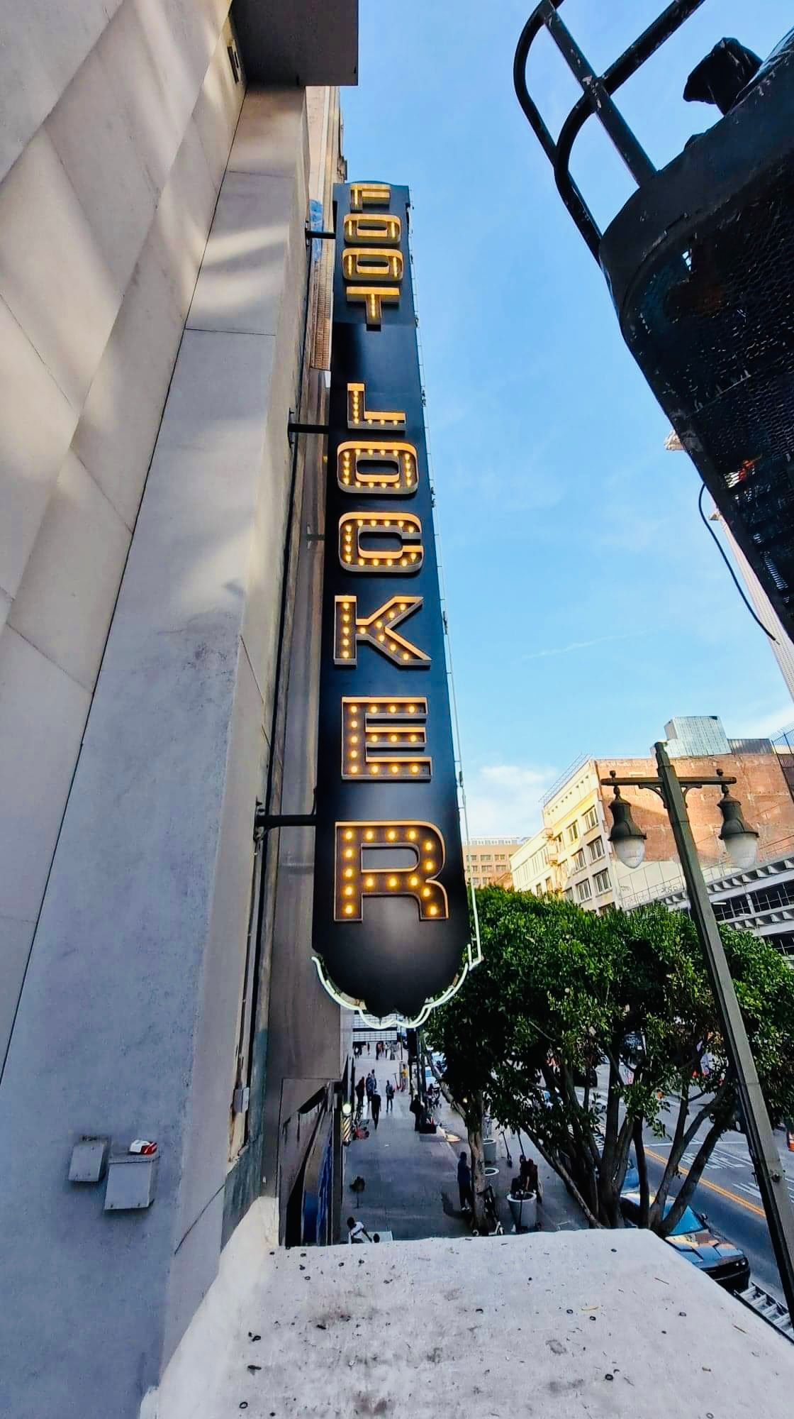 A sign on the side of a building that says elevator