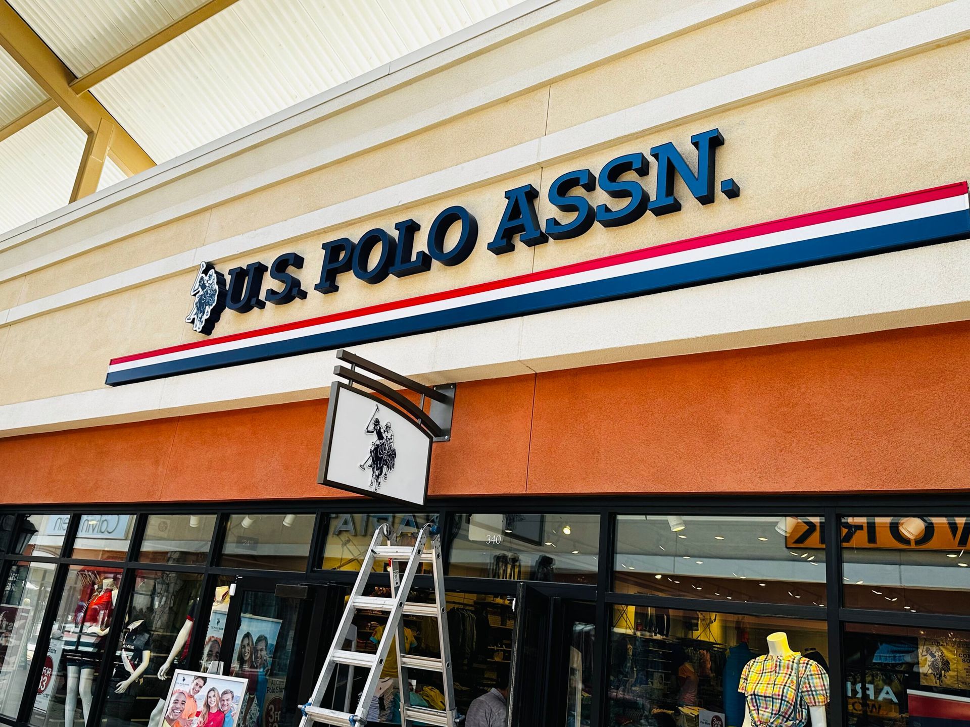A store front with a sign that says us polo assn
