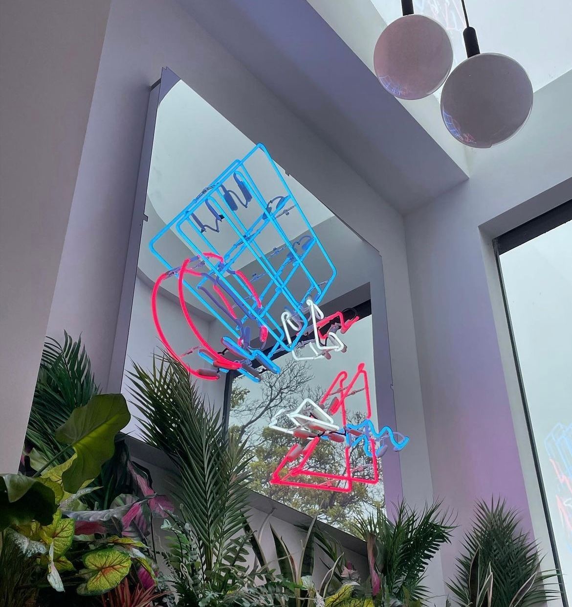 A mirror with a neon sign that says ' i love you ' on it