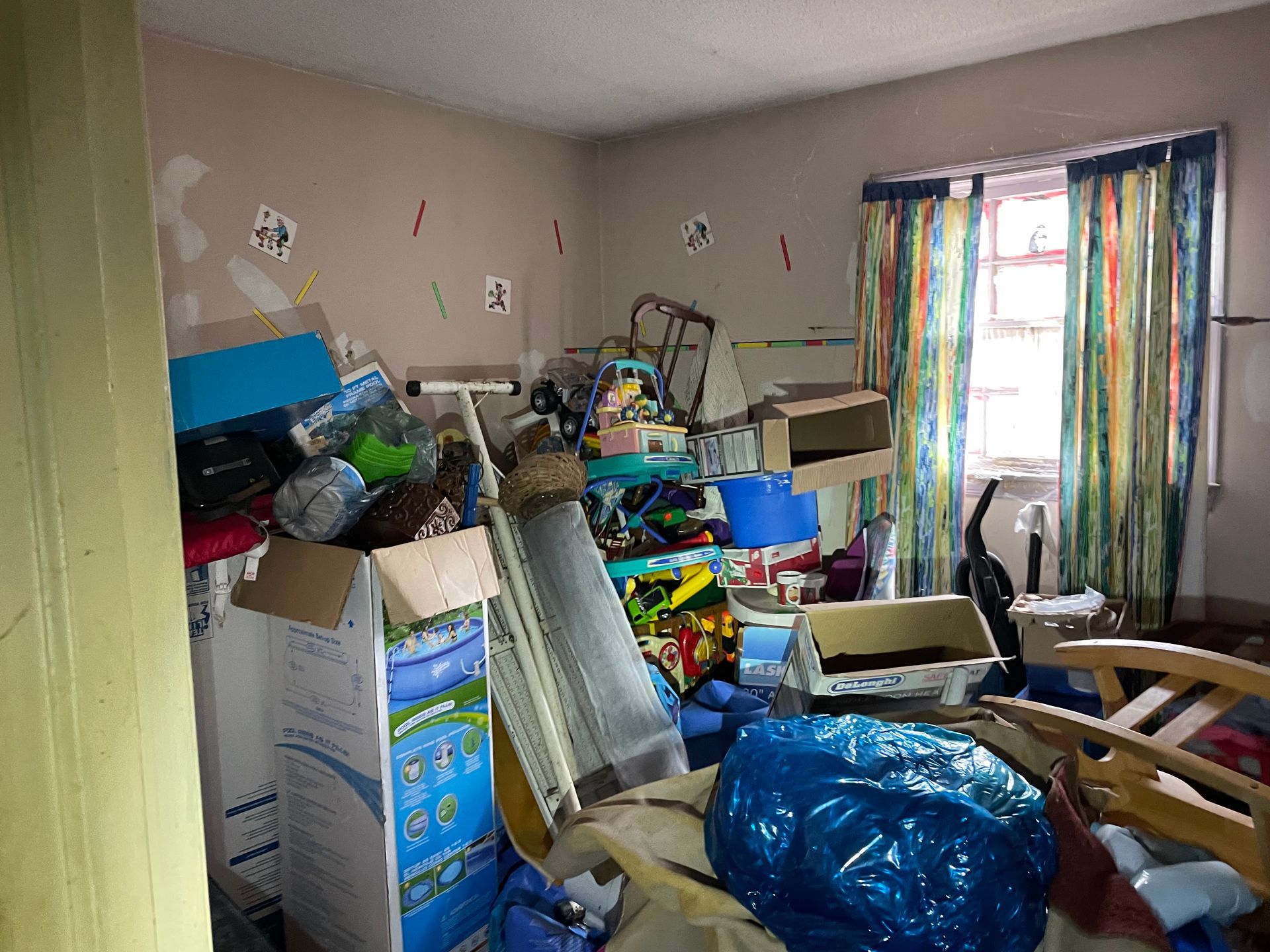 A room filled with lots of boxes and toys.