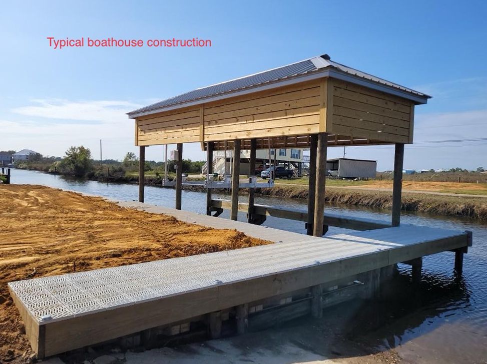 A boathouse is being built next to a body of water