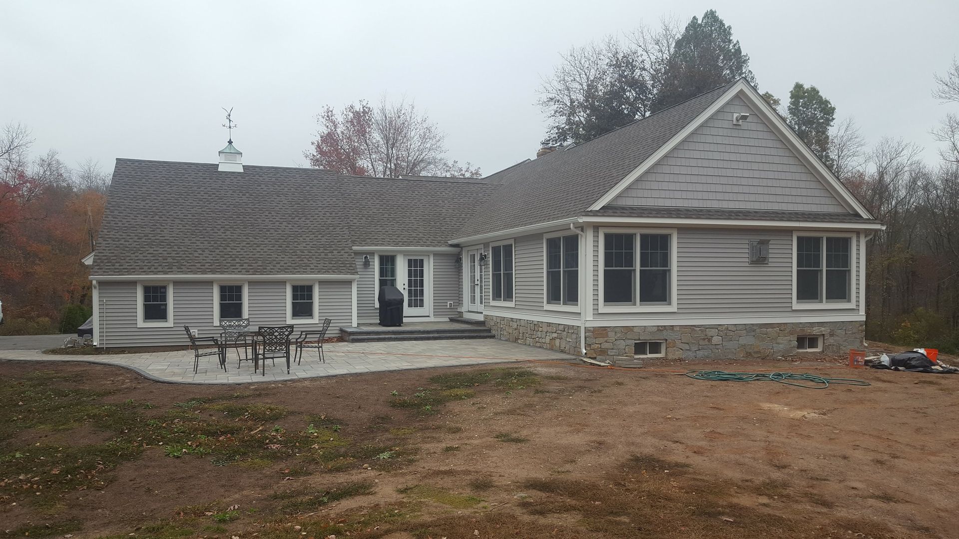 A large house with a patio in front of it
