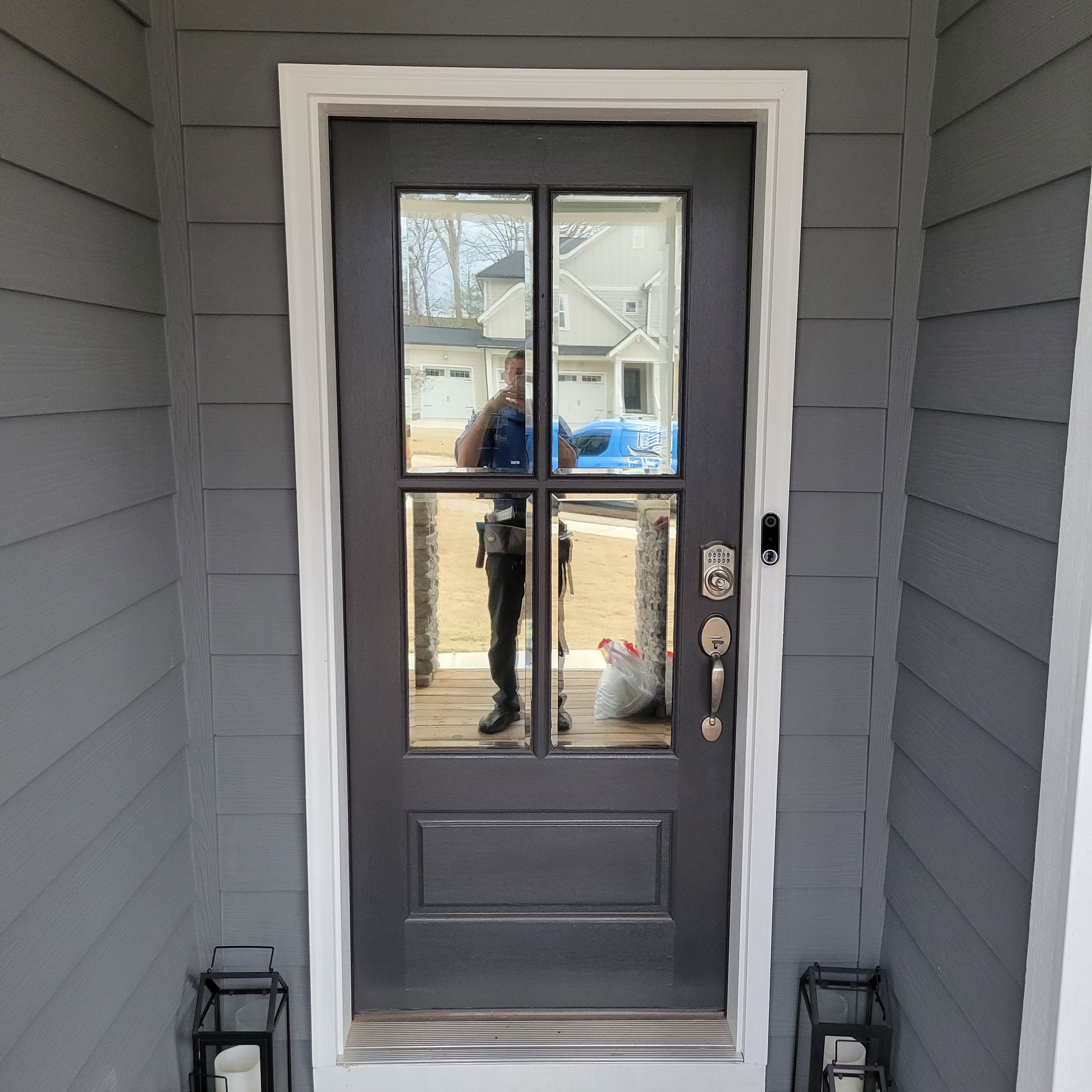 A door with a reflection of a person in it