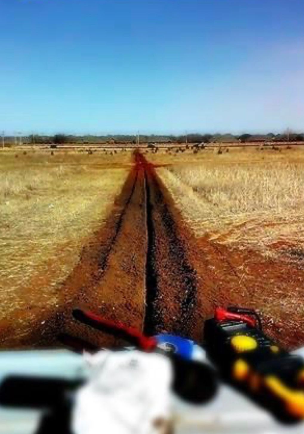 a person is riding a motorcycle on a dirt road