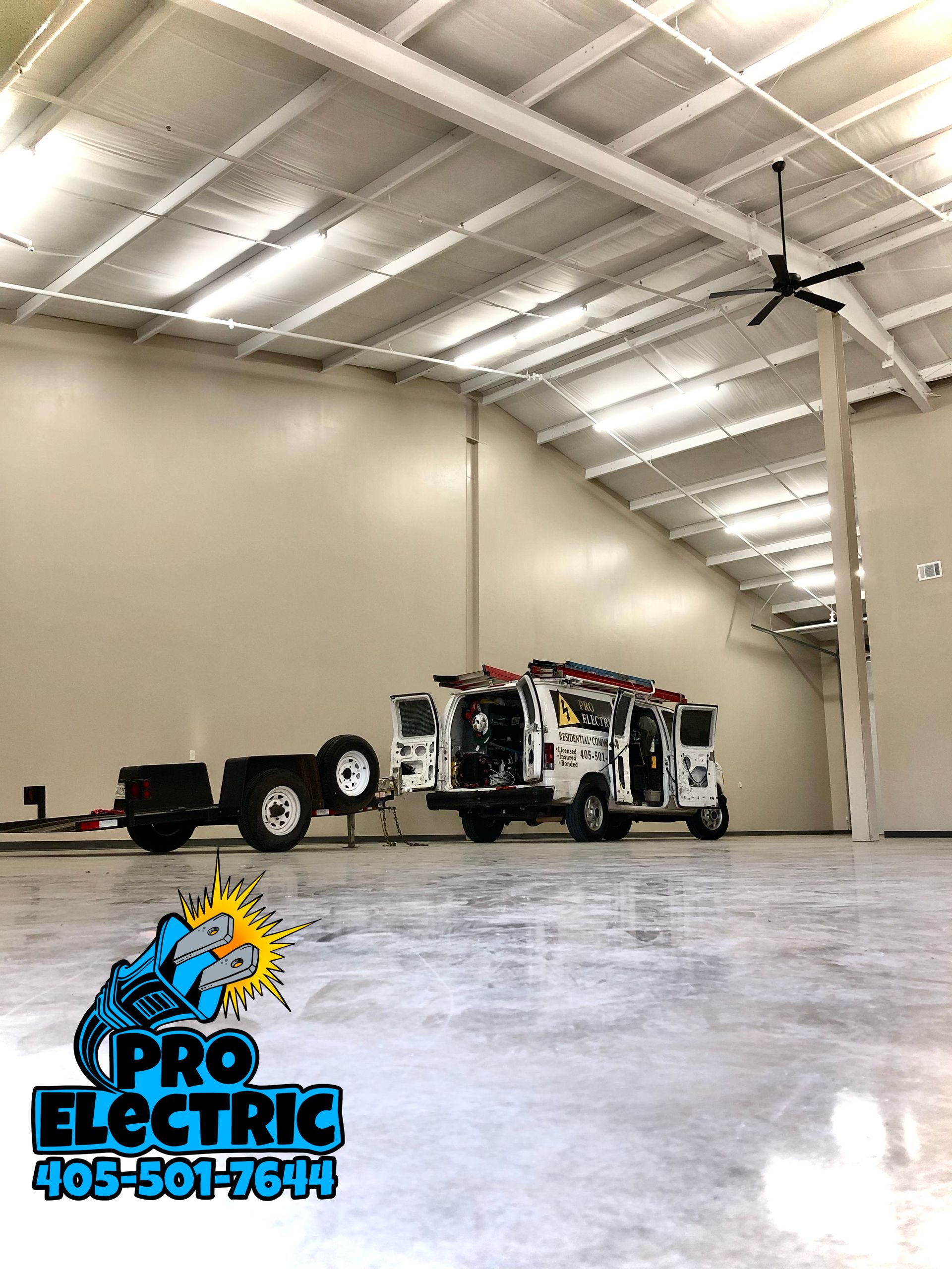 two trucks are parked in a large empty warehouse