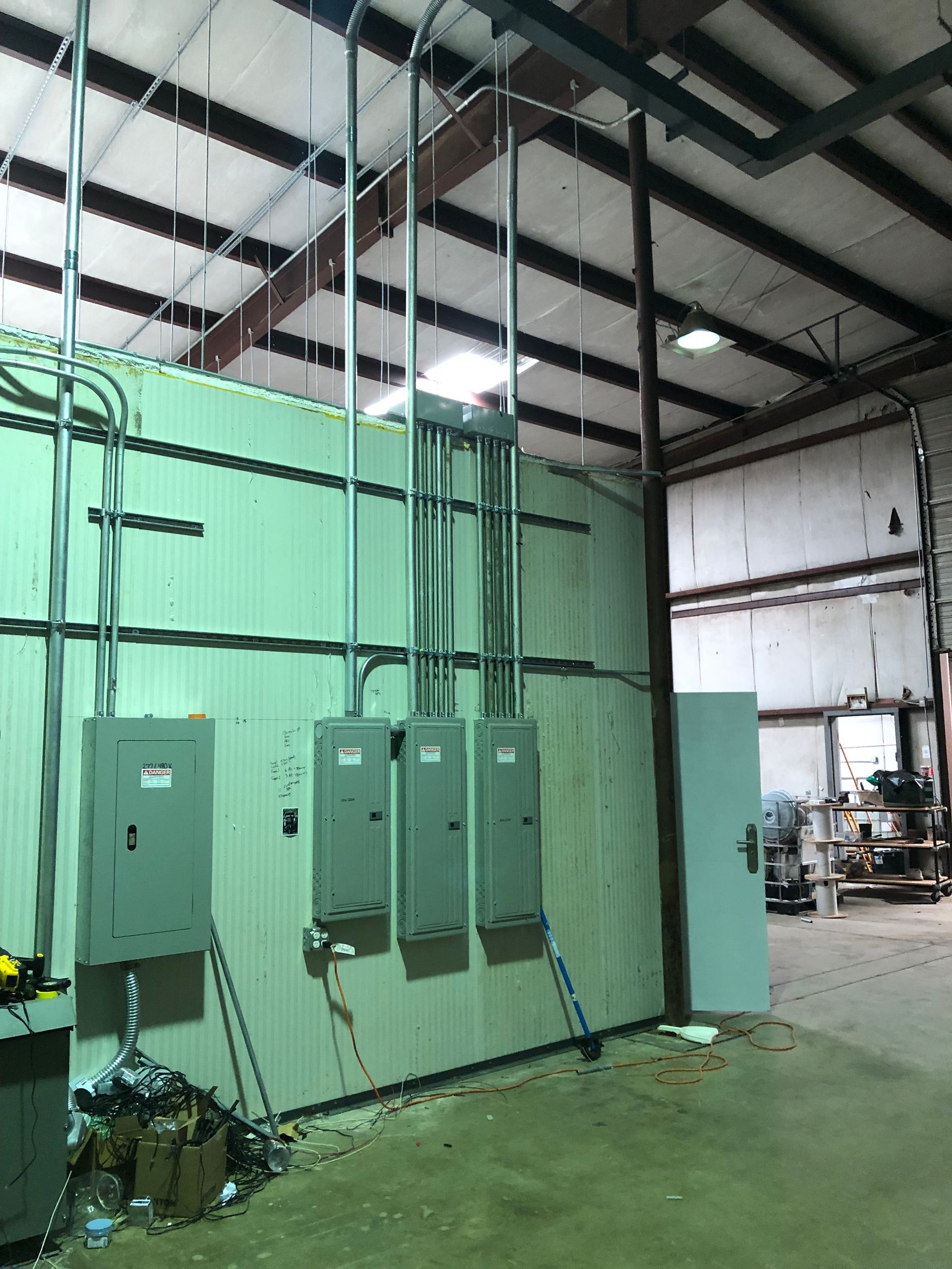 a warehouse with a lot of electrical boxes on the wall