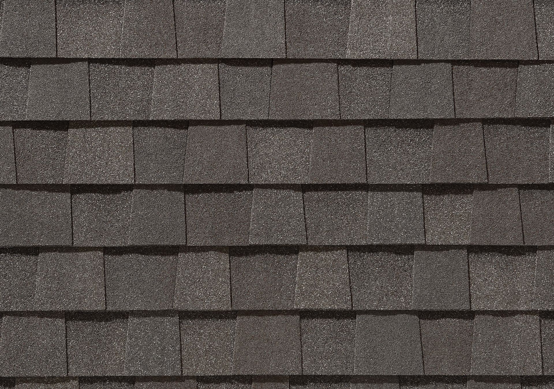 A close up of a row of shingles on a roof.