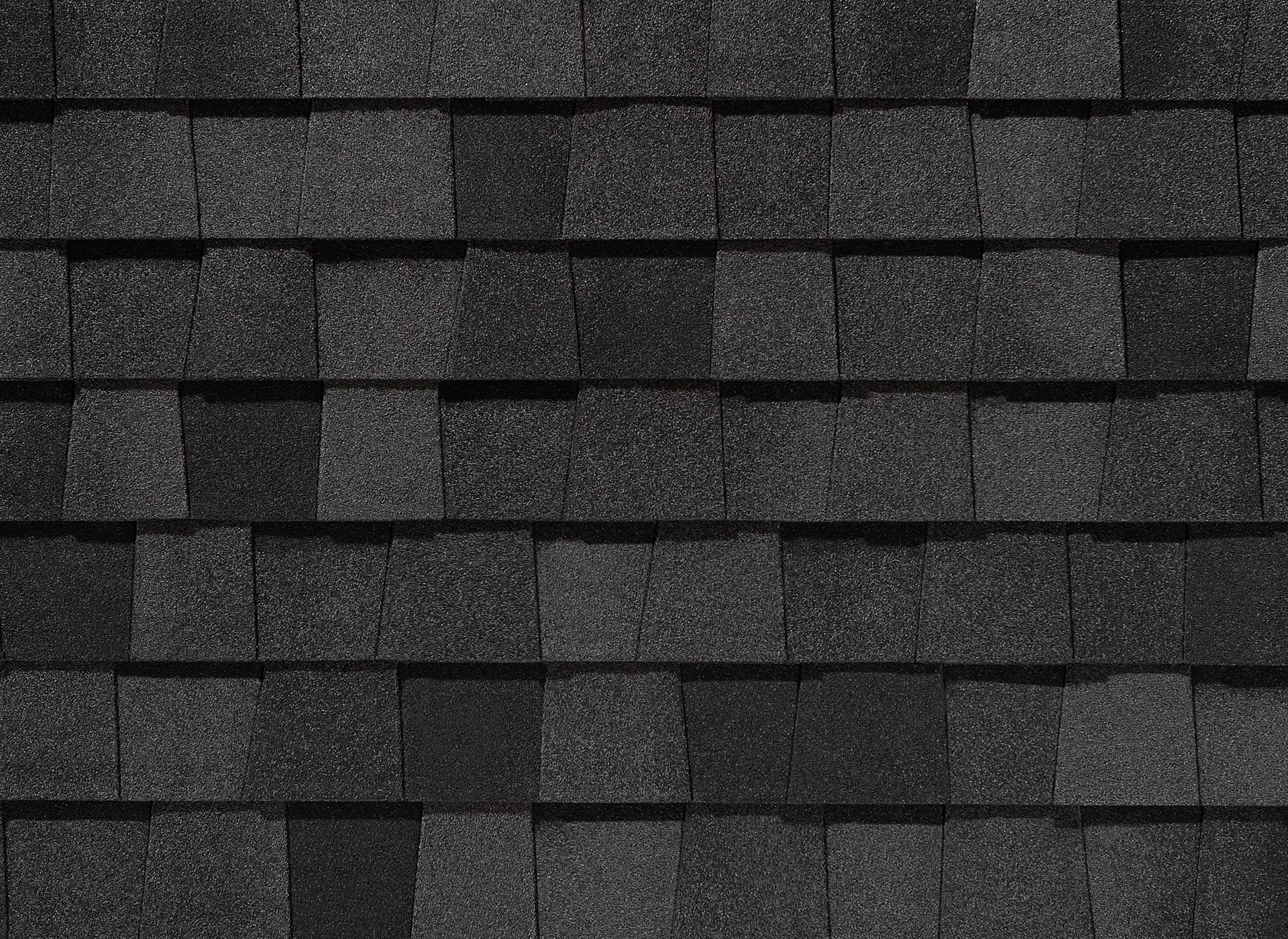 A close up of a black shingle roof.