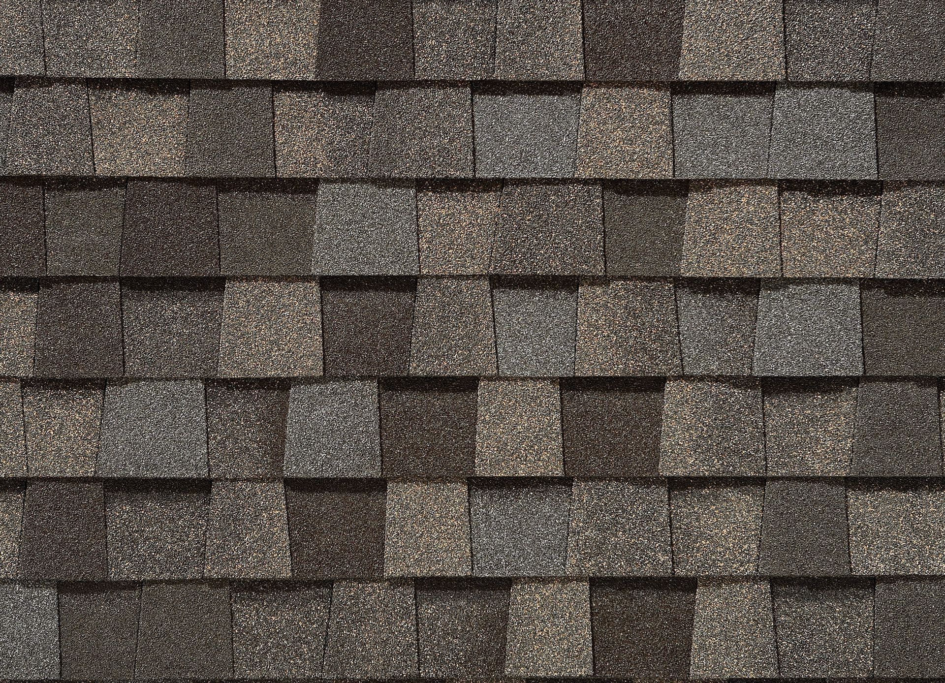 A close up of a roof with shingles on it.