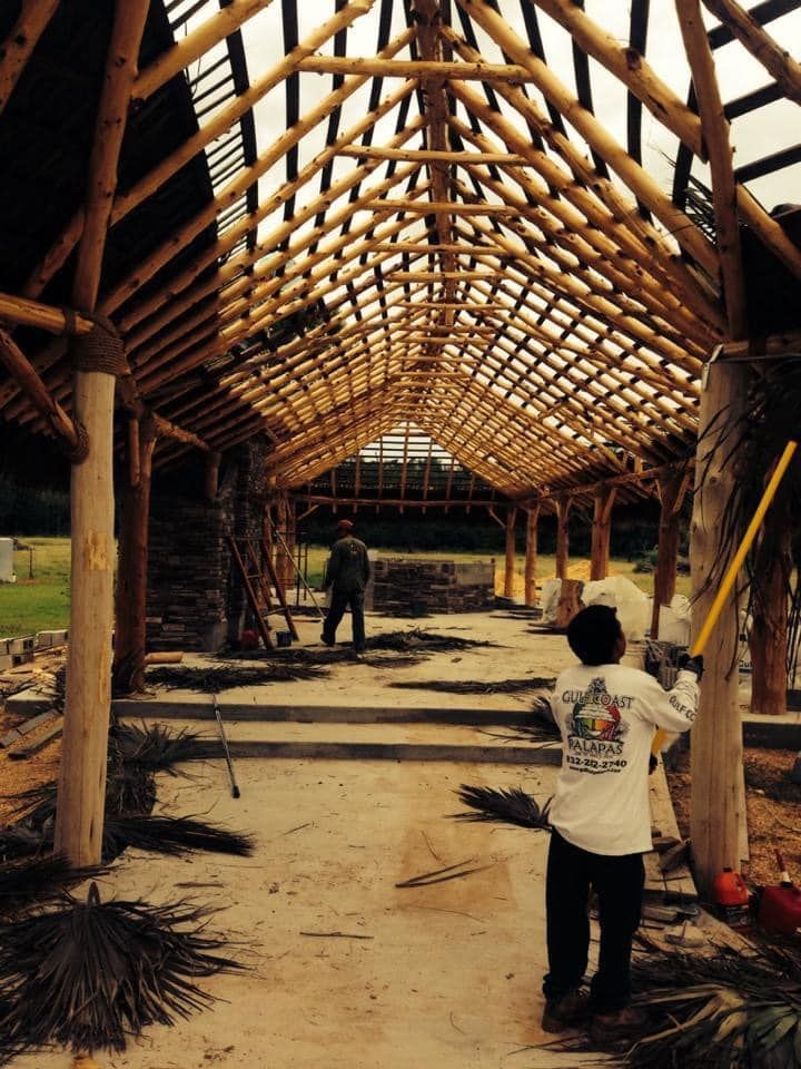A man wearing a shirt that says ' hawaii ' on it