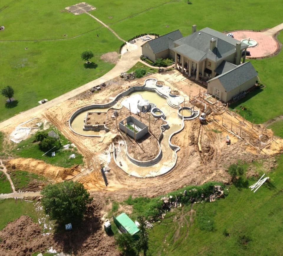 An aerial view of a large house under construction