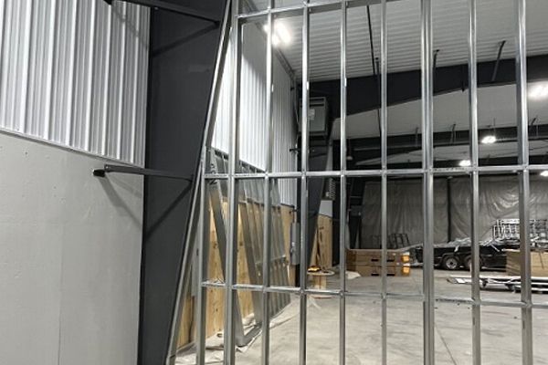 A metal frame is being built in a building.