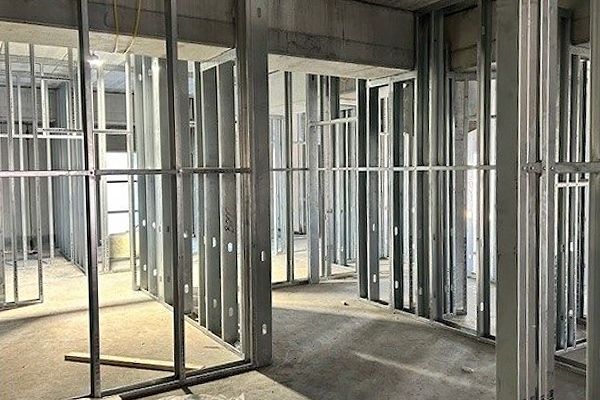A room under construction with a lot of metal frames.