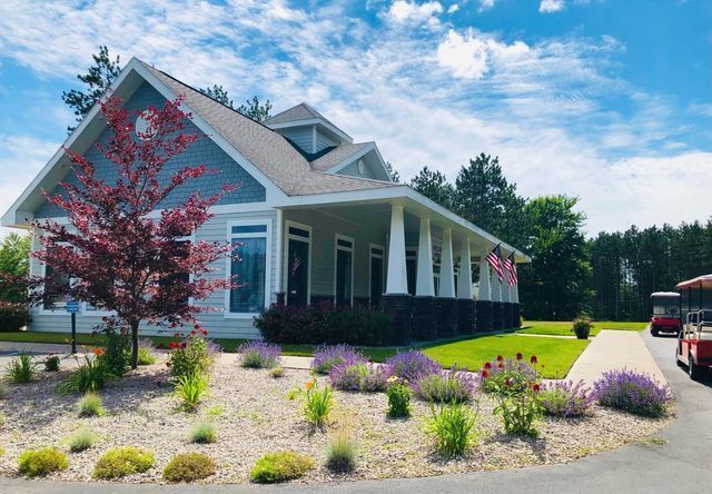a house with a golf cart parked in front of it