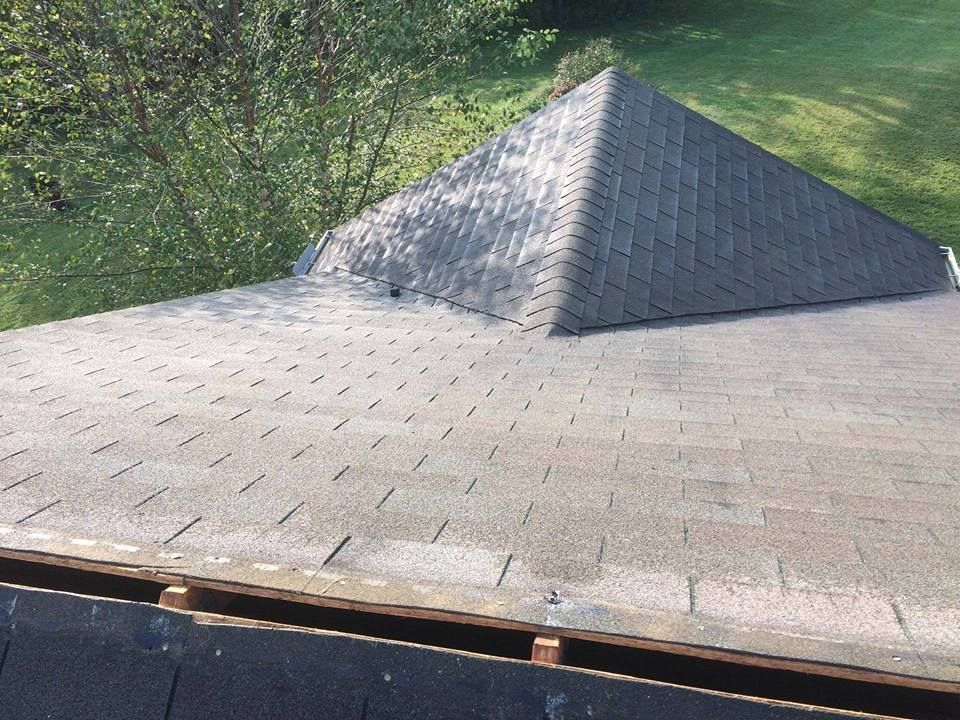 A close up of a roof with a pyramid shaped roof.