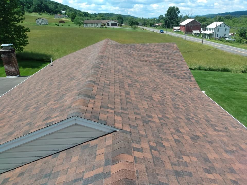 The roof of a house has a skylight on it