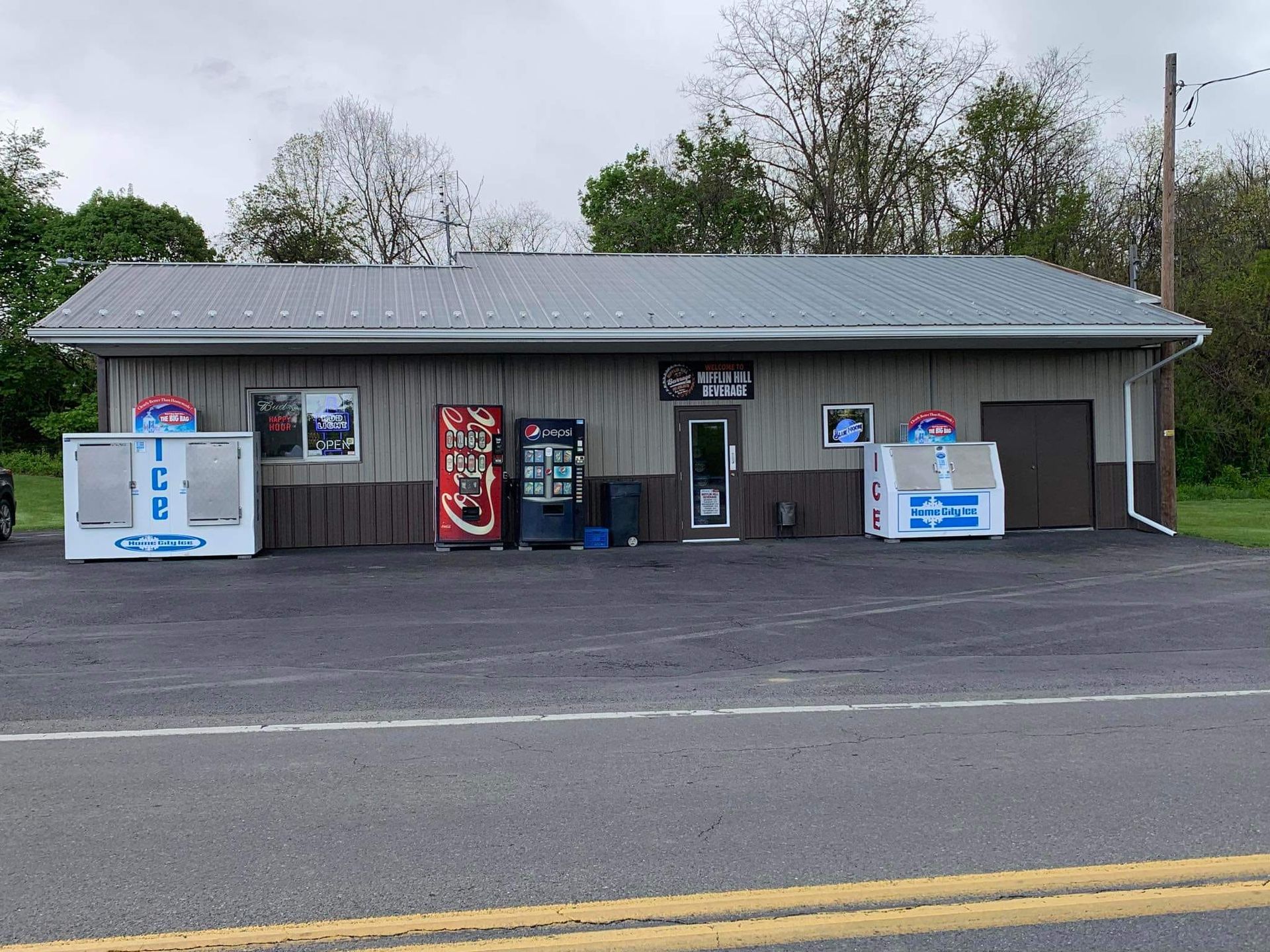 A building with a pepsi machine in front of it