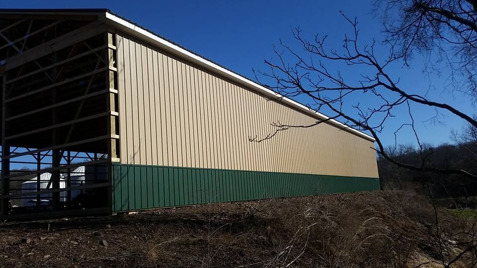 A large building with a green stripe on the side