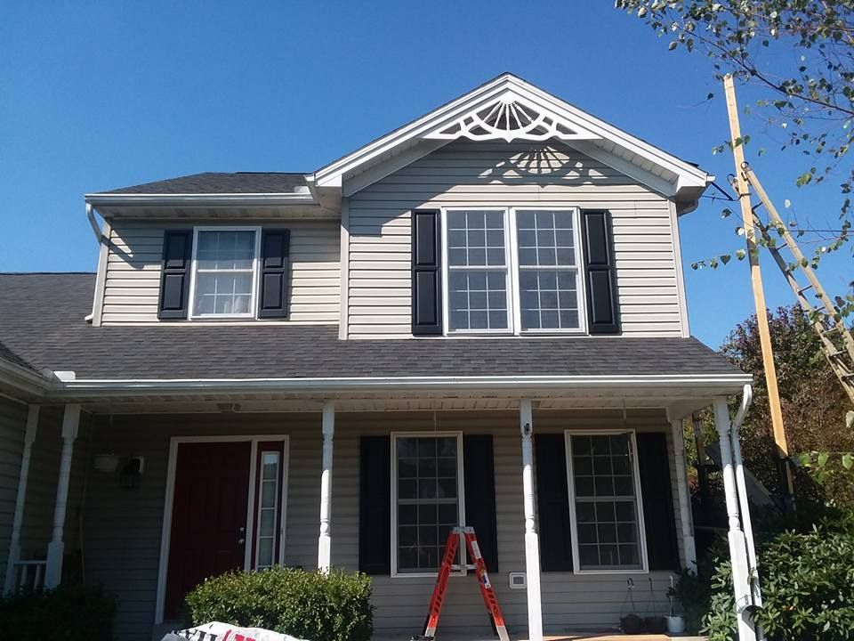 A house with a red door and black shutters