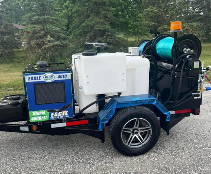 A trailer with a machine on it that says eagle on it